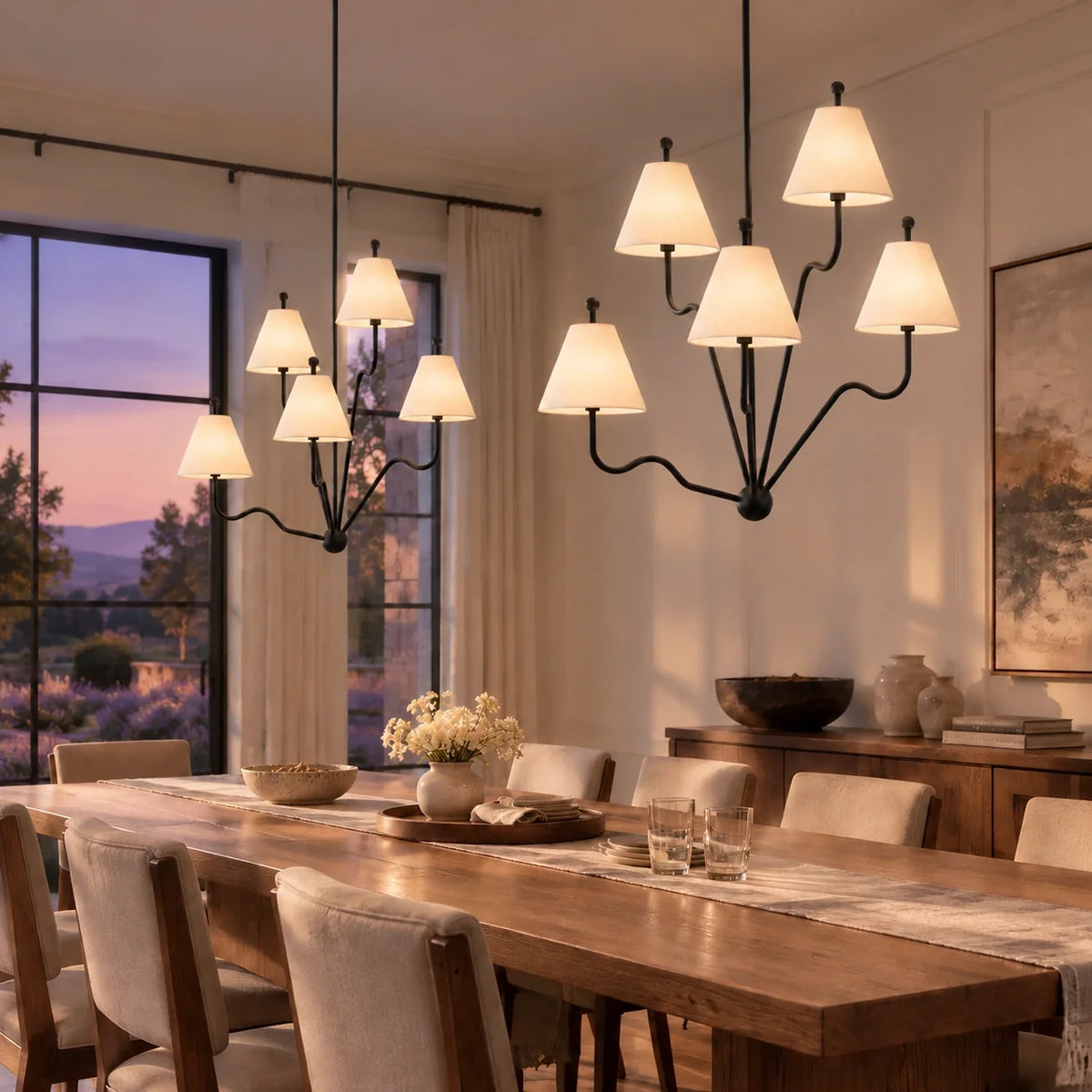 Two Isolde black chandeliers in an evening dining room