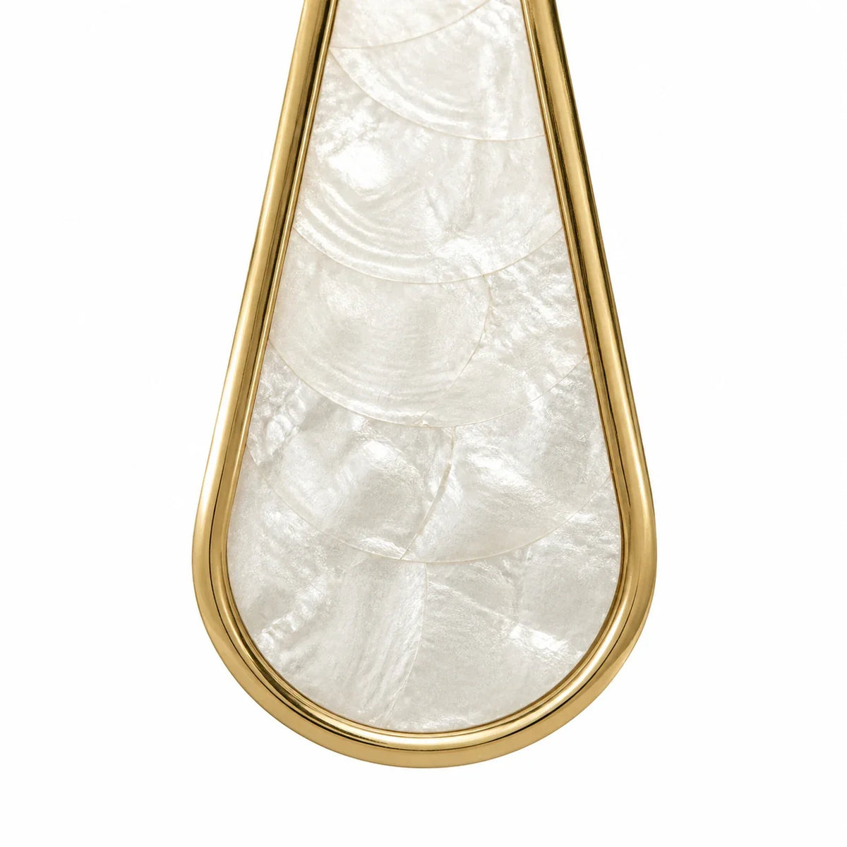 Close view of pearly Capiz shell panels framed in warm gold metal