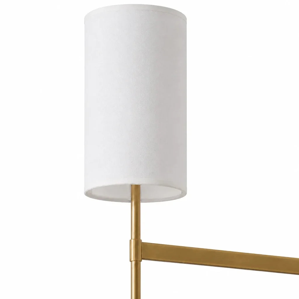 Close detail of the Aster white fabric shade and continuous brass arm